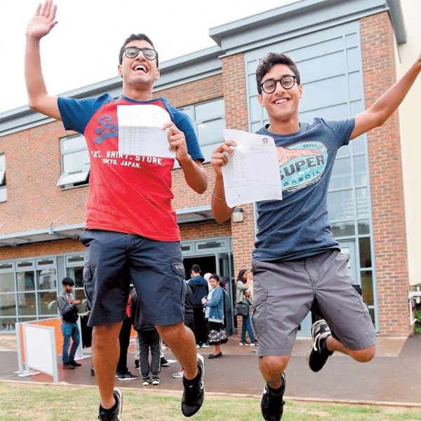 Twins Arjun and Zora graduating GCSEs and jumping with joy