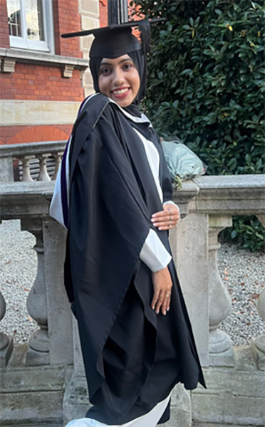 Female Varsity Tuition student graduating dressed in graduation clothing